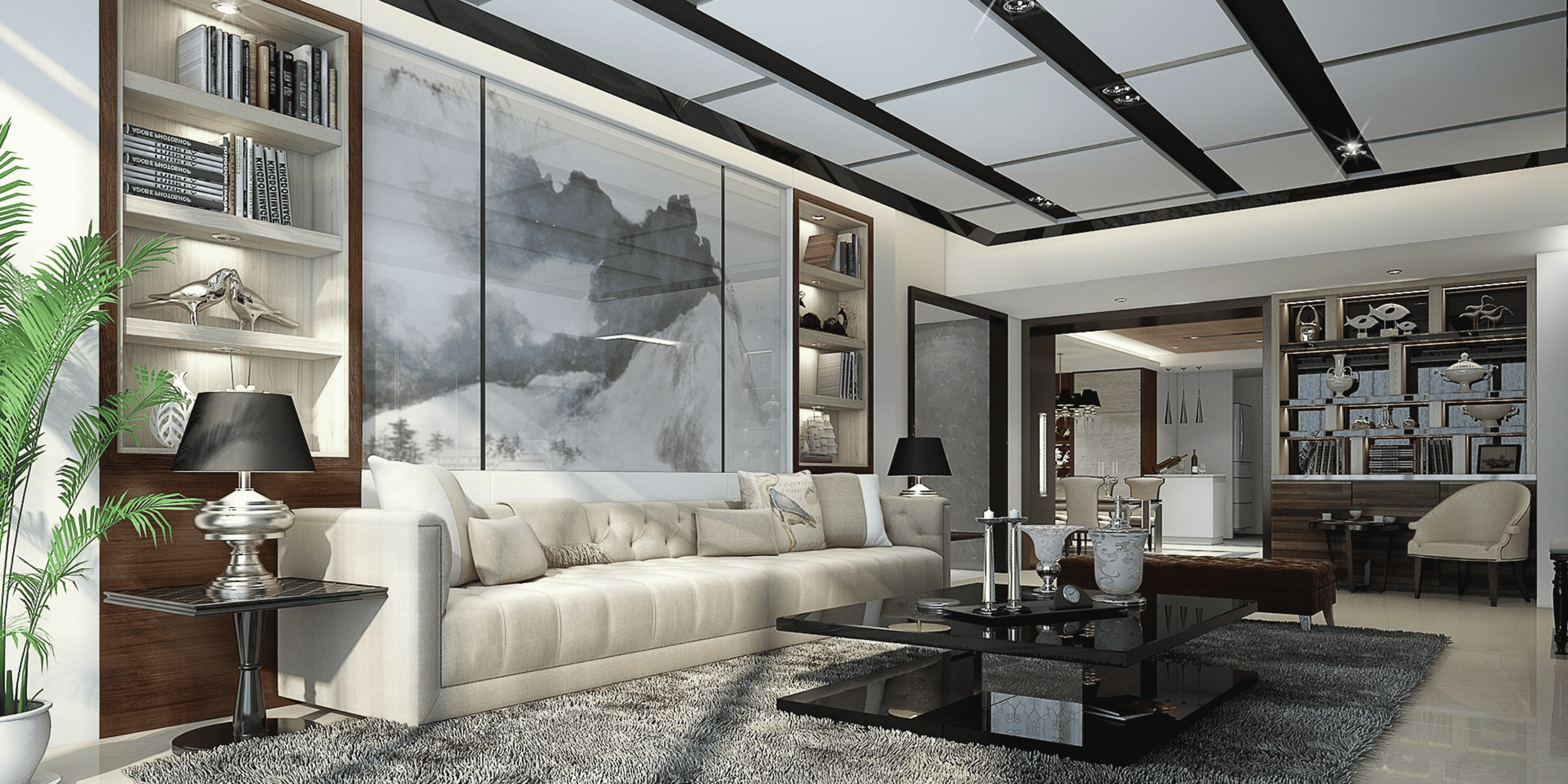 Modern living room with a large sofa, coffee table, and decorative elements.